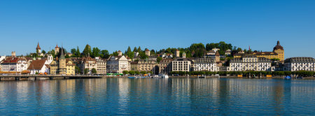Lucerne, Switzerland - July 11, 2025: A panoramic view of a picturesque lakeside town Lucerne with...