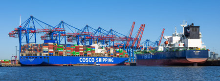 Hamburg, Germany - July 1, 2025: Busy industrial port of Hamburg with cranes and shipping...