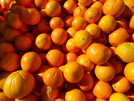 close-up of oranges at a market stallの写真素材