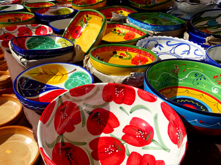 close-up of very colorful pottery items in a marketの写真素材