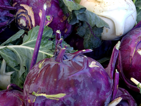 detail of several violet turnips at a market stallの写真素材