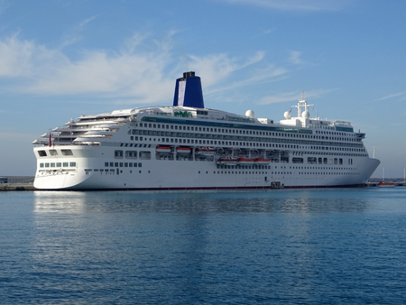 panoramic view of a cruise ship docked at the harborの写真素材