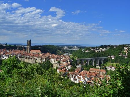 Panoramic view of the down town of Friborg with the bridges of Z?hringuen and Poya in the background. Friborg, Switzerlandの写真素材