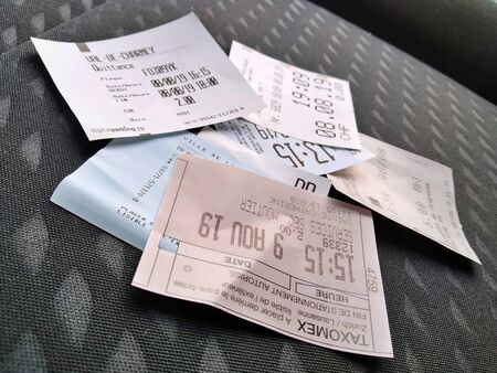 Close-up detail of several parking tickets on car seat. Reduction of car traffic in the city