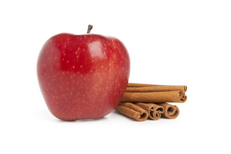 Red Apple and Cinnamon on white backgroundの写真素材