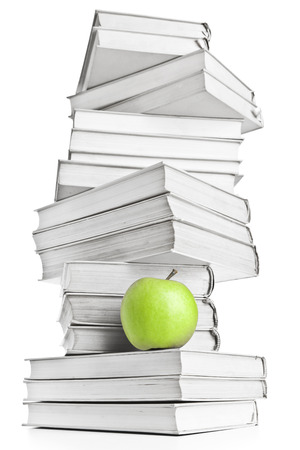 Stack of books and  green appleの写真素材