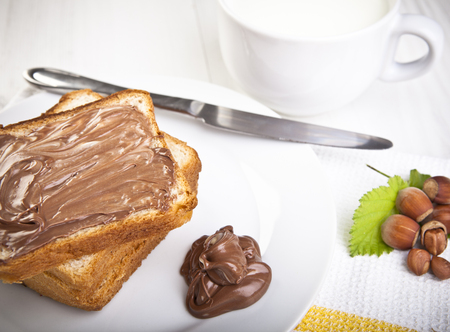 Bread with sweet chocolate hazelnut spreadの写真素材