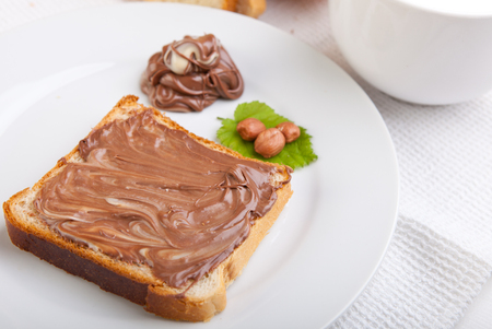 Bread with sweet chocolate hazelnut spreadの写真素材