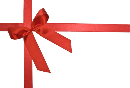 Red gift ribbon and bow isolated on whiteの写真素材
