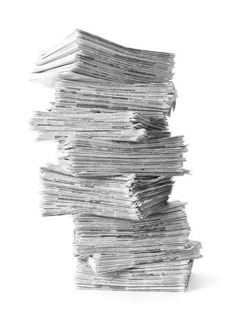 Pile of old newspapers isolated on a white background