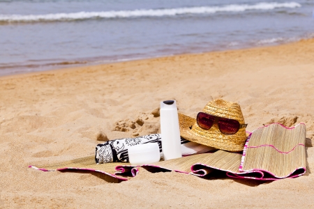 summer holiday accessories on a beachの写真素材