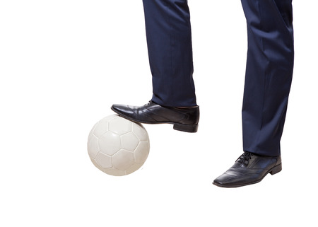 a young businessman with soccer ball isolated on a white の写真素材