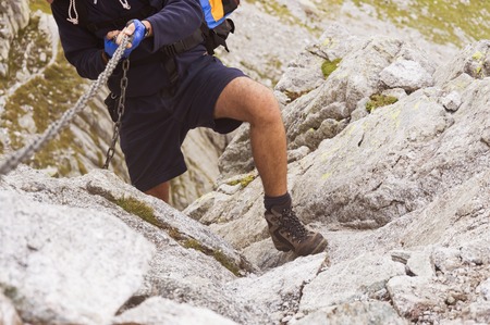 hiking on the Alps with difficult terrain and beautiful landscapesの写真素材