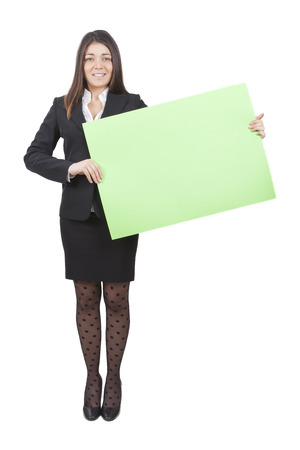 A businesswoman is keeping big green signboardの写真素材