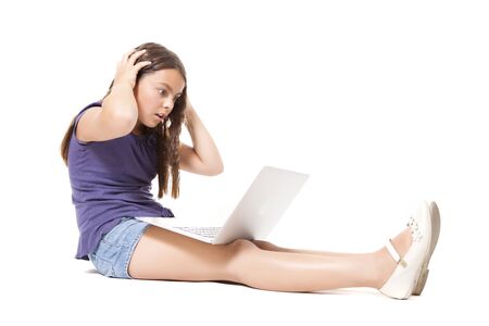 young caucasian cute girl having difficulty with pcの写真素材