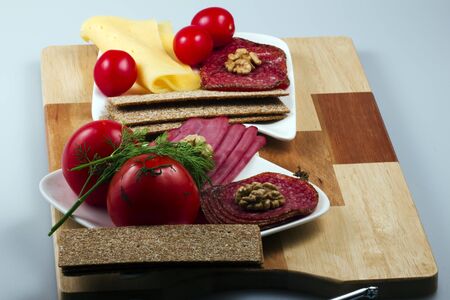 with meat and cheese on a boardの写真素材