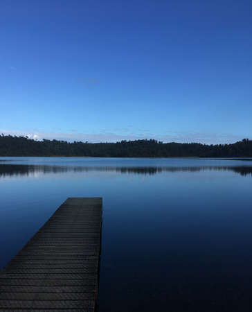 lake dock at sunrise New Zealandの写真素材