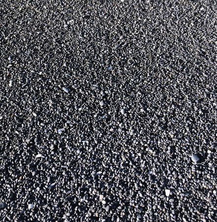 beach coast small stones blackの写真素材