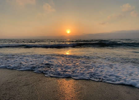 fading beach sunset at summer days, black and white backgroundの写真素材