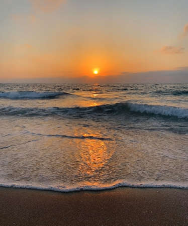 fading beach sunset at summer days, black and white backgroundの写真素材