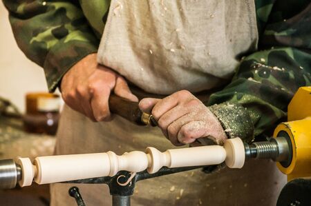 The carpenter at work at the benchの写真素材