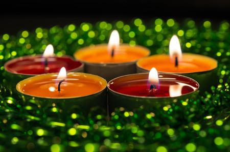 Burning candles and green sparkling decorの写真素材