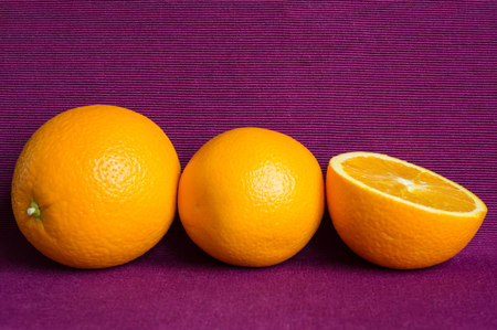 Oranges on a violet backgroundの写真素材