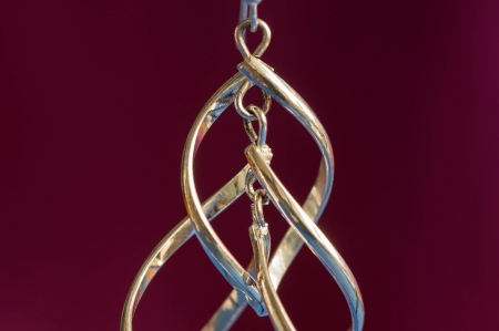 Earring from white metal in the form of spiralsの写真素材