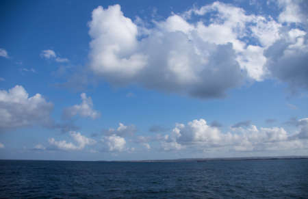 Fine clouds over the tropical ocean in a sunny day
