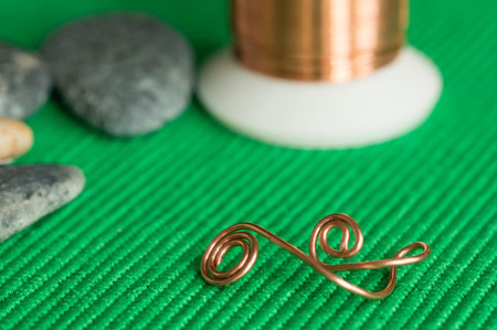 Stones, copper wire and element from a copper wireの写真素材