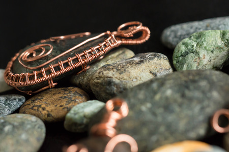 Wire wrapped pendant on stonesの写真素材