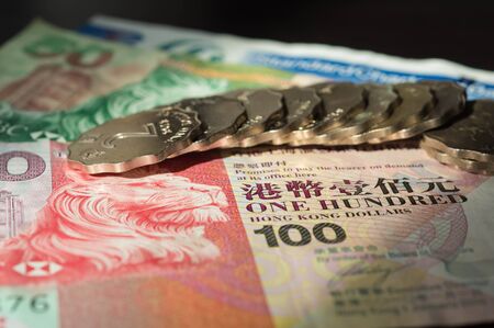 The Hong Kong dollars and coins lit with the sunの写真素材