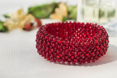 Wattled bracelet from red beads close upの写真素材