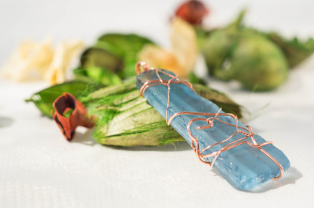 Handmade pendent from glass and a copper wire close upの写真素材