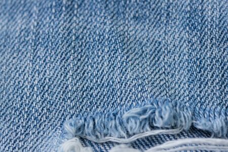 Old torn jeans texture. Textile background