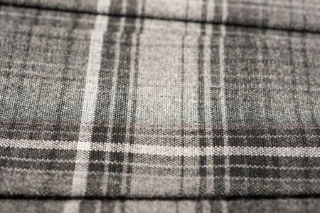 Checkered fabric of gray color close up. Textile background