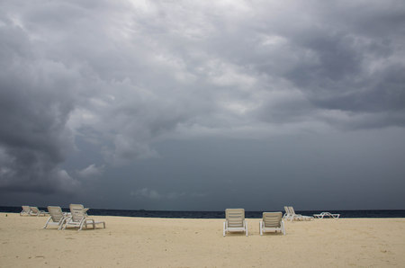 Empty beach on a cloudy day in the rainy seasonの写真素材