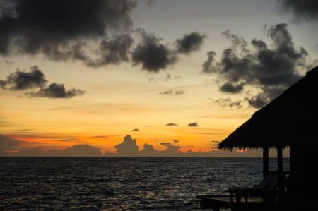 Cloudy sky during sunset over the tropical resortの写真素材
