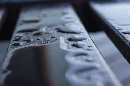 Drops of water on the wooden boards after rainの写真素材