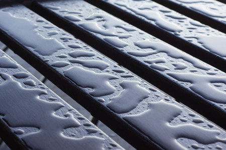 Drops of water on the wooden boards after rainの写真素材