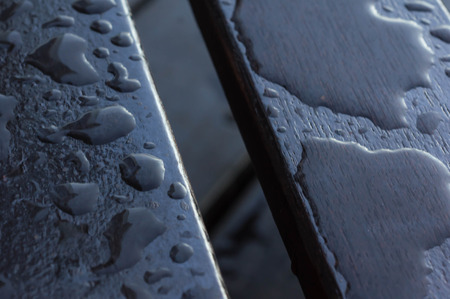 Drops of water on the wooden boards after rainの写真素材