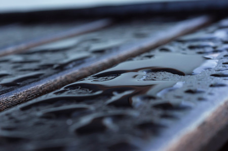 Drops of water on the wooden boards after rainの写真素材