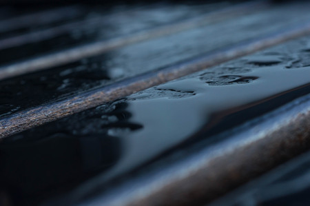 Drops of water on the wooden boards after rainの写真素材