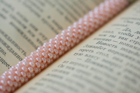 Knitted bracelet from pink beads close upの写真素材