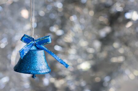 Christmas decorations on a background of shiny tinselの写真素材