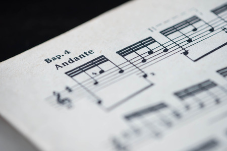 Musical tempo "Andante" in a music book close upの写真素材