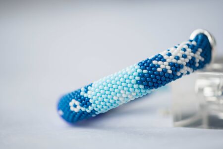Handmade beaded bracelet with the image of snowflakesの写真素材