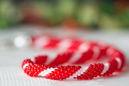 Beaded crochet necklace from beads of red and white colorの写真素材