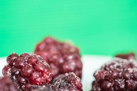 The frozen berries of a blackberry close upの写真素材
