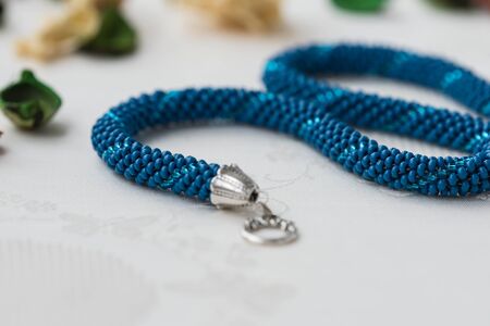 Handmade beaded necklace blue color close upの写真素材
